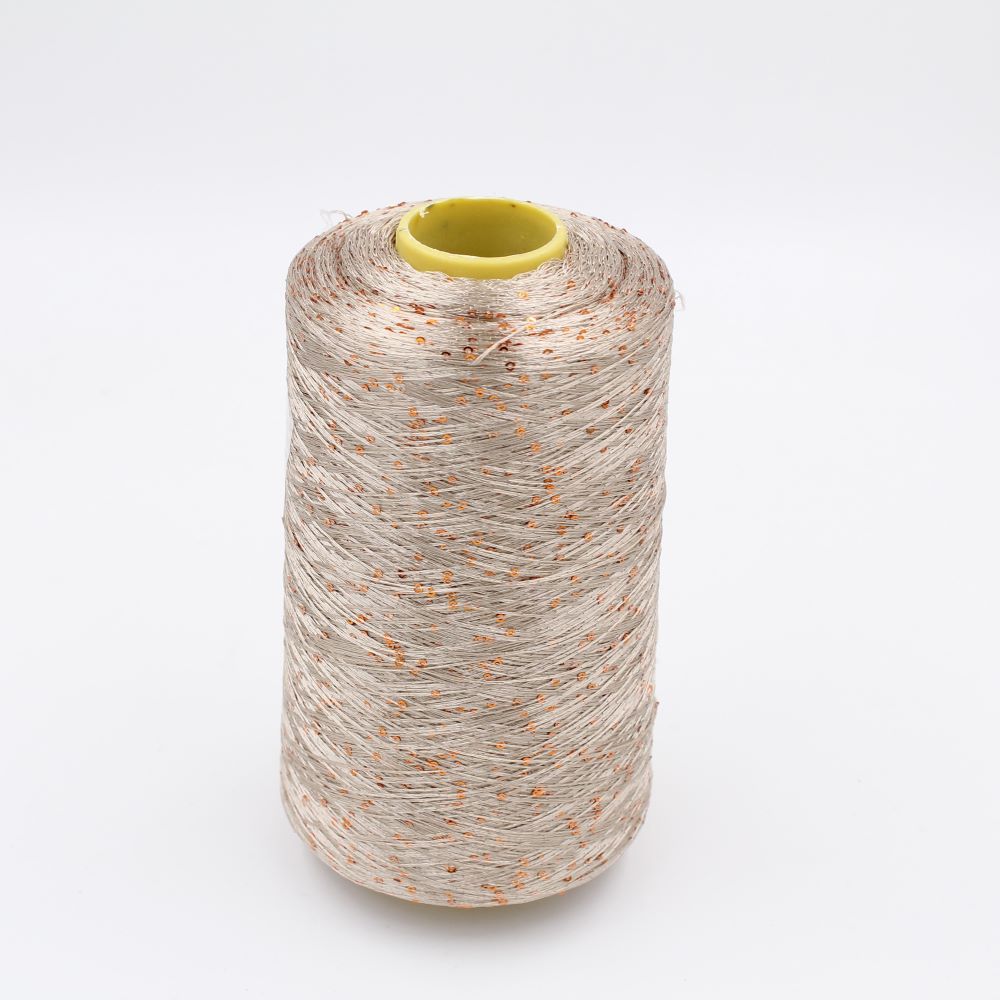 100% polyester yarn, nm. 8000, with sequins beige color cones 620 gr